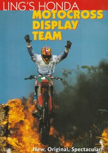 stunt rider on motorcycle having just jumped through flames